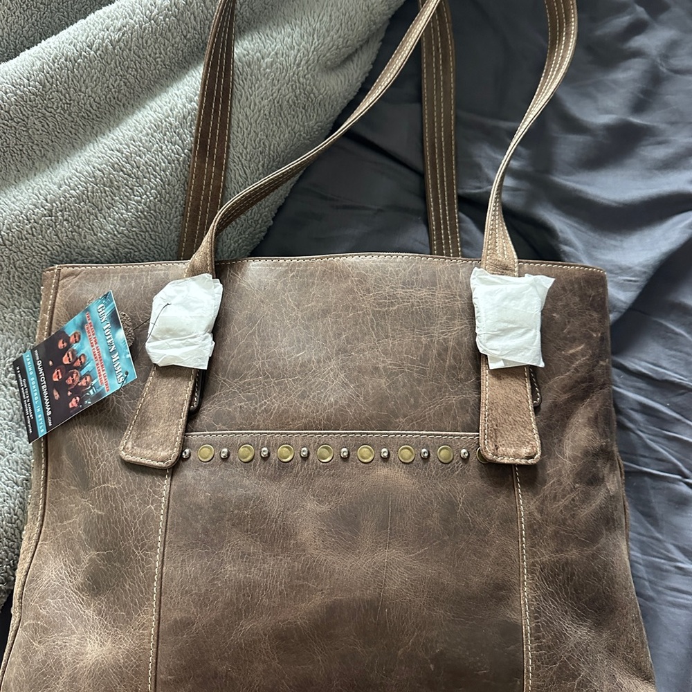 Brown Leather Tote Bag with Stud Accents. Concealed carry